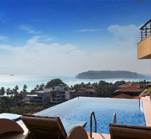 Infinity pool overlooking ocean with scenic island and coastal views