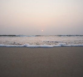 Sunrise view with waves at Betalbatim Beach Goa