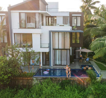 pacious multi-storey villa featuring private pool and lush greenery