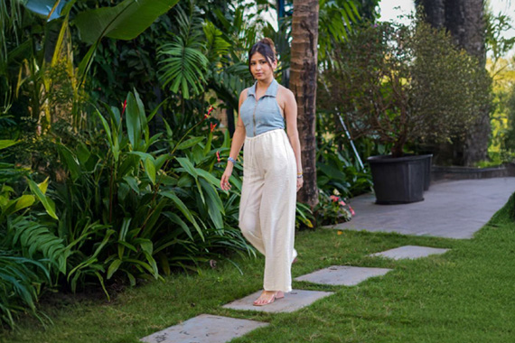 Woman walking through a landscaped private garden
