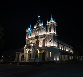 Beautifully illuminated church at night with elegant architecture