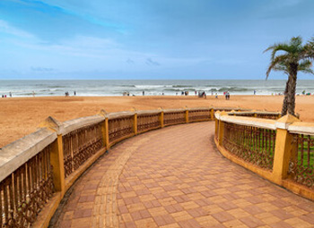 Calangute Beach walkway overlooking sandy shoreline