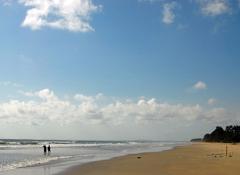 Peaceful Varca Beach with long sandy shoreline and gentle waves
