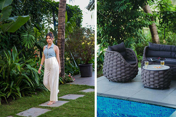 Woman walking through the villa garden and outdoor seating area beside the pool