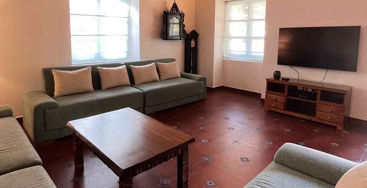 Luxury villa living room in Goa with sofas and TV