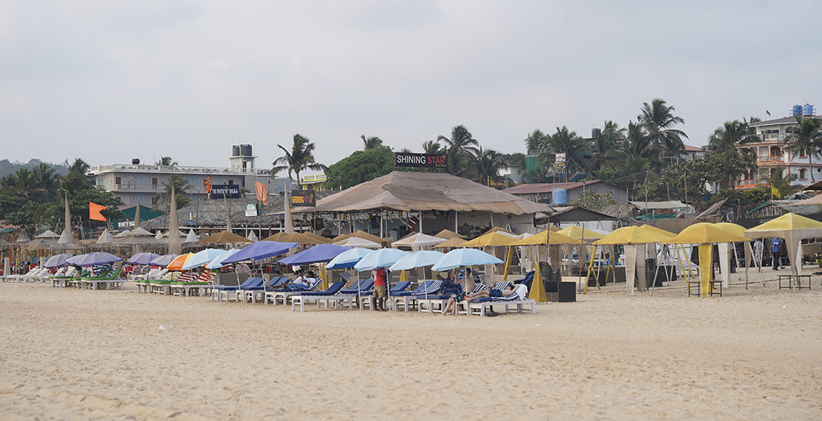 Beachside bars and colorful shacks along Baga Beach in Goa