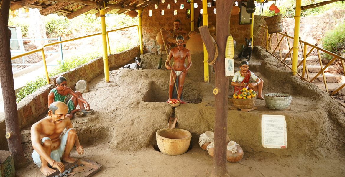 Traditional Goan village life exhibit with lifelike sculptures at Ancestral Goa (Big Foot Goa) in Loutolim