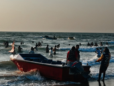 Visitors enjoying speed boat rides and water sports activities at Anjuna Beach Goa along the Arabian Sea