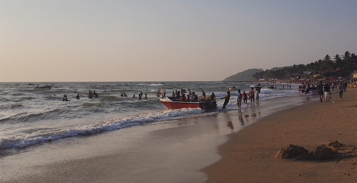 Sunset view with fishing boat at Anjuna Beach Goa