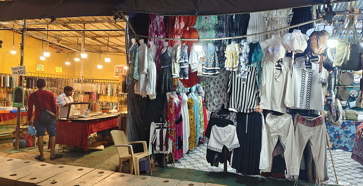 Clothing, fashion, and accessory stalls at Anjuna Flea Market, a popular shopping destination in Goa