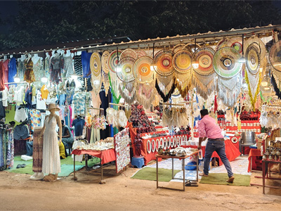 Colorful handicraft, dreamcatcher, and souvenir stalls at Anjuna Flea Market, a popular shopping destination in Goa