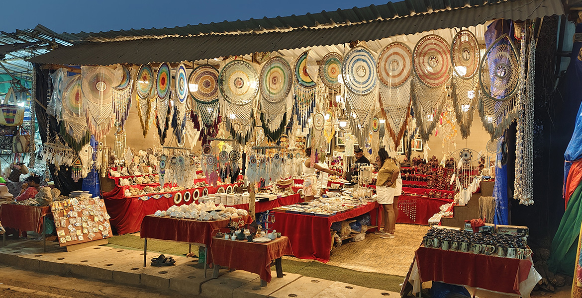 Handicrafts and dreamcatcher shop at Anjuna Flea Market in Goa with colorful handmade decor items