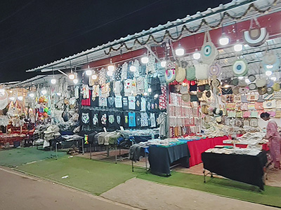 Colorful handicraft and fashion stalls at Anjuna Flea Market in Goa at night