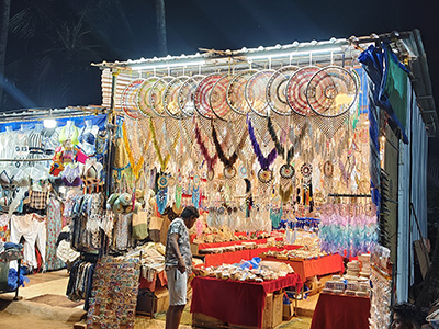Colorful handicrafts, dreamcatchers and shopping stalls at Anjuna Flea Market in Goa