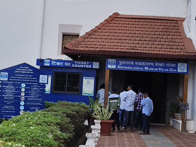 Entrance of the Archaeological Museum in Old Goa with ticket counter and visitors