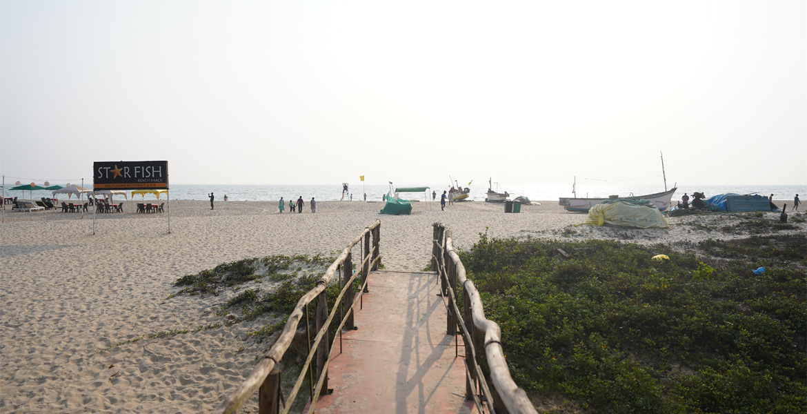 Beach entrance and fishing boats at Arossim Beach, Goa