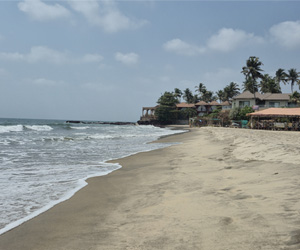 Sandy coastline and sea view at Ashwem Beach, Goa