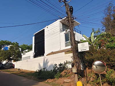 Goa surrounded by lush greenery and a peaceful village setting