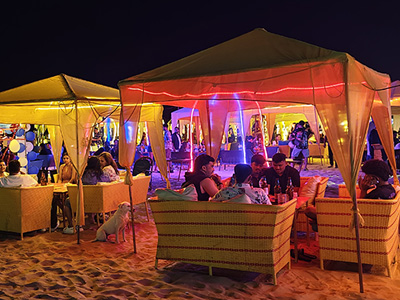 Nightlife tents and beach seating at Baga Beach, Goa.