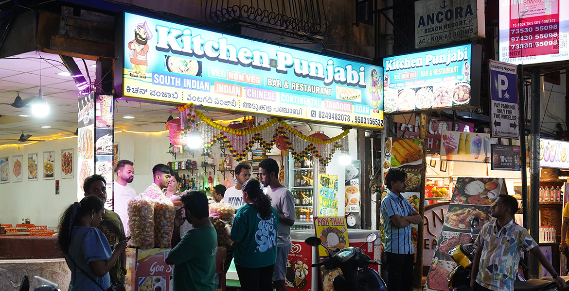 Baga Food Street nightlife scene in Goa with restaurants and street food stalls at night
