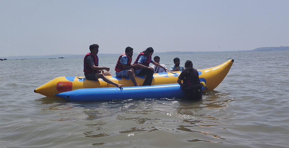 Tourists riding a banana boat in Goa