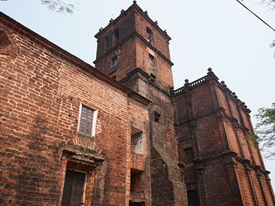 Historic Basilica of Bom Jesus church in Old Goa with Portuguese-style architecture and bell tower