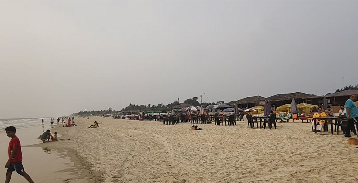 Beachfront restaurants with outdoor seating along the sandy shoreline of Benaulim Beach Goa