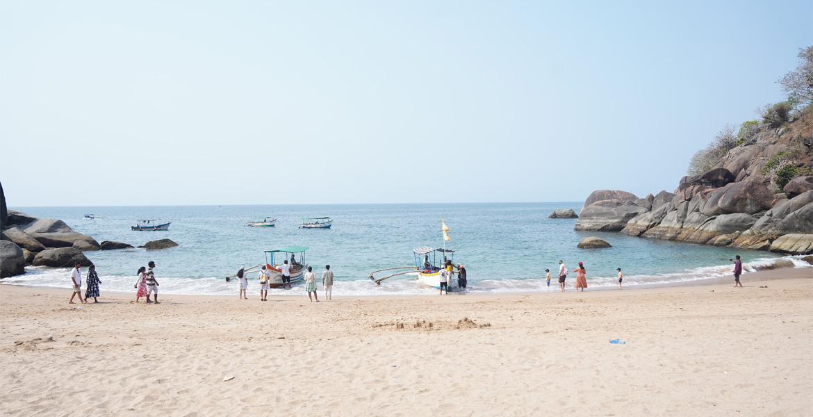 Boats landing on the shore at Butterfly Beach, Goa