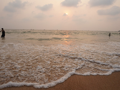 People enjoying sunset at Calangute Beach