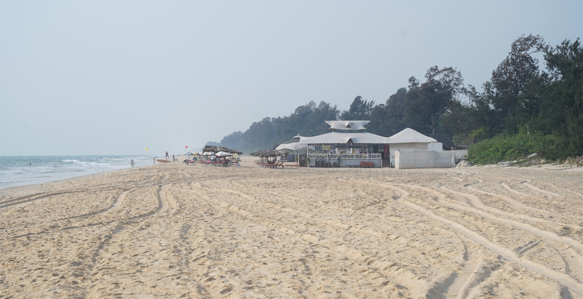 Beach shacks along the shoreline at Cavelossim Beach, Goa