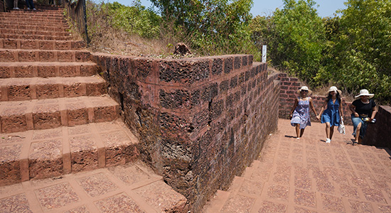 Visitors exploring Chapora Fort Goa