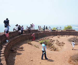 Visitors exploring Chapora Fort, Goa