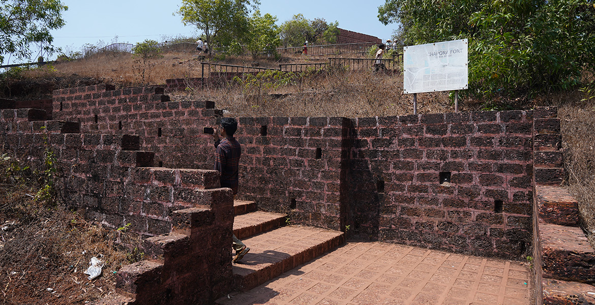 Historic stone walls and pathways inside Chapora Fort in Goa