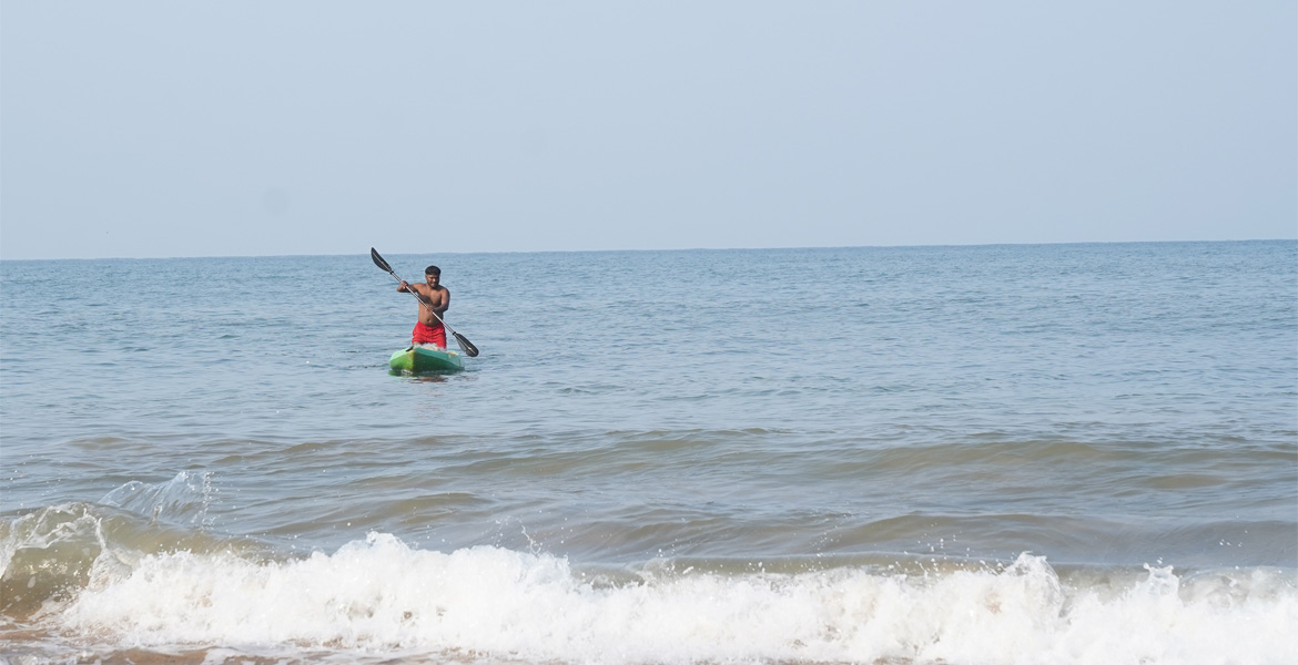 Person kayaking at Cola Beach, Goa