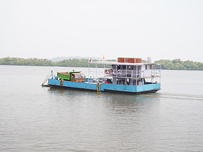 Passenger ferry crossing the Mandovi River to Divar Island in Goa surrounded by scenic backwaters