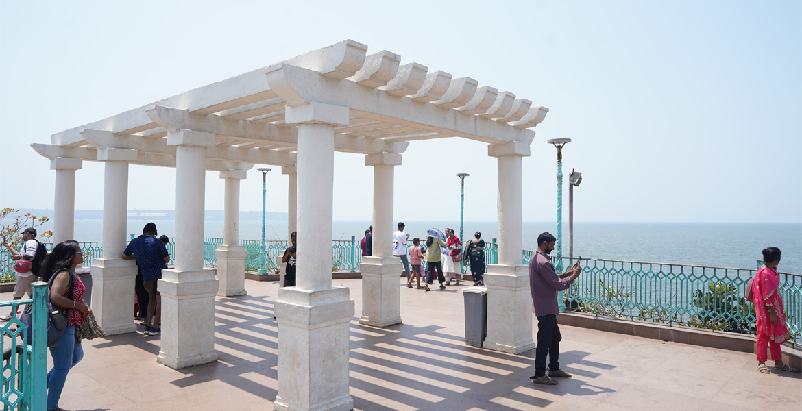 Visitors enjoying panoramic Arabian Sea views from the Dona Paula Viewpoint in Goa