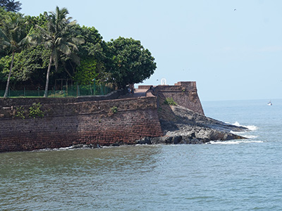 Historic coastal walls and sea view at Fort Aguada in Goa