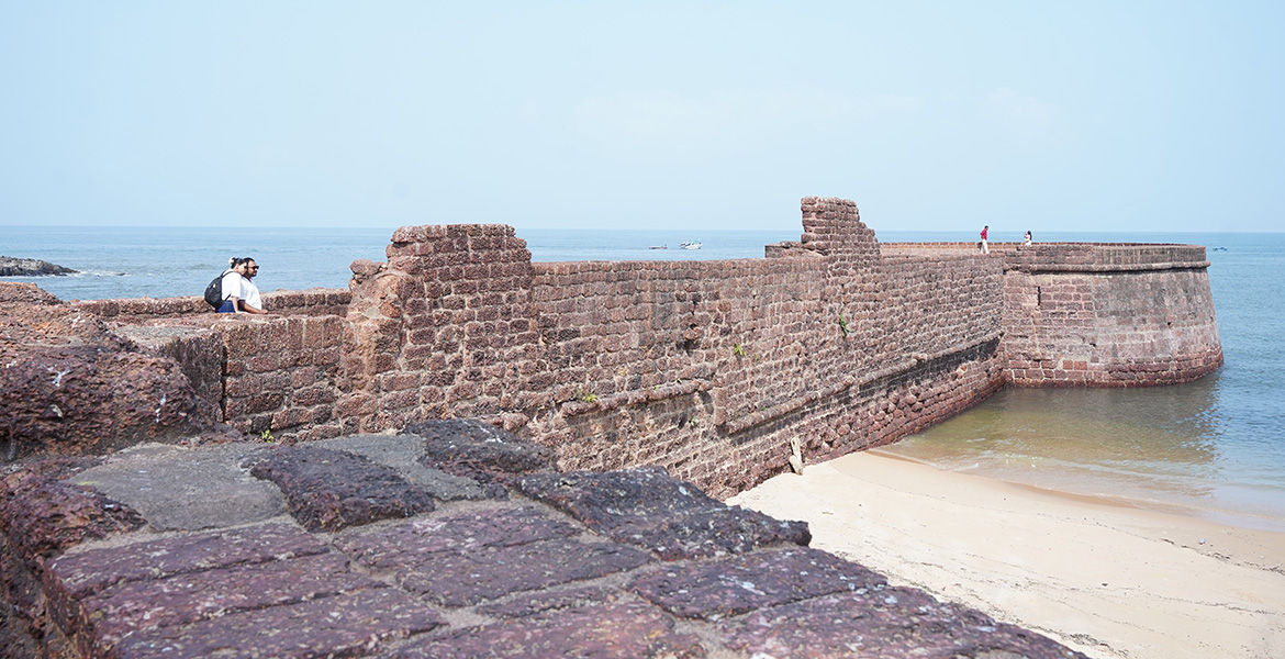 Historic stone walls and coastal view at Fort Aguada in Goa beside the Arabian Sea