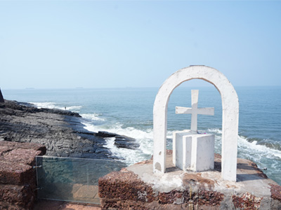 Historic white cross overlooking the Arabian Sea from Fort Aguada in North Goa