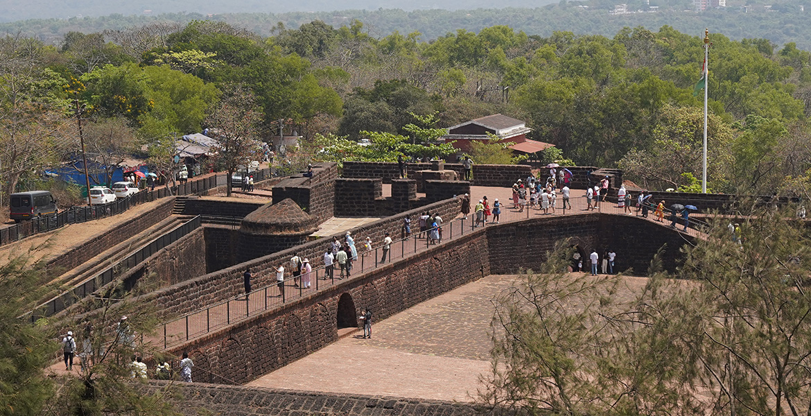 Tourists walking inside Fort Aguada in Goa