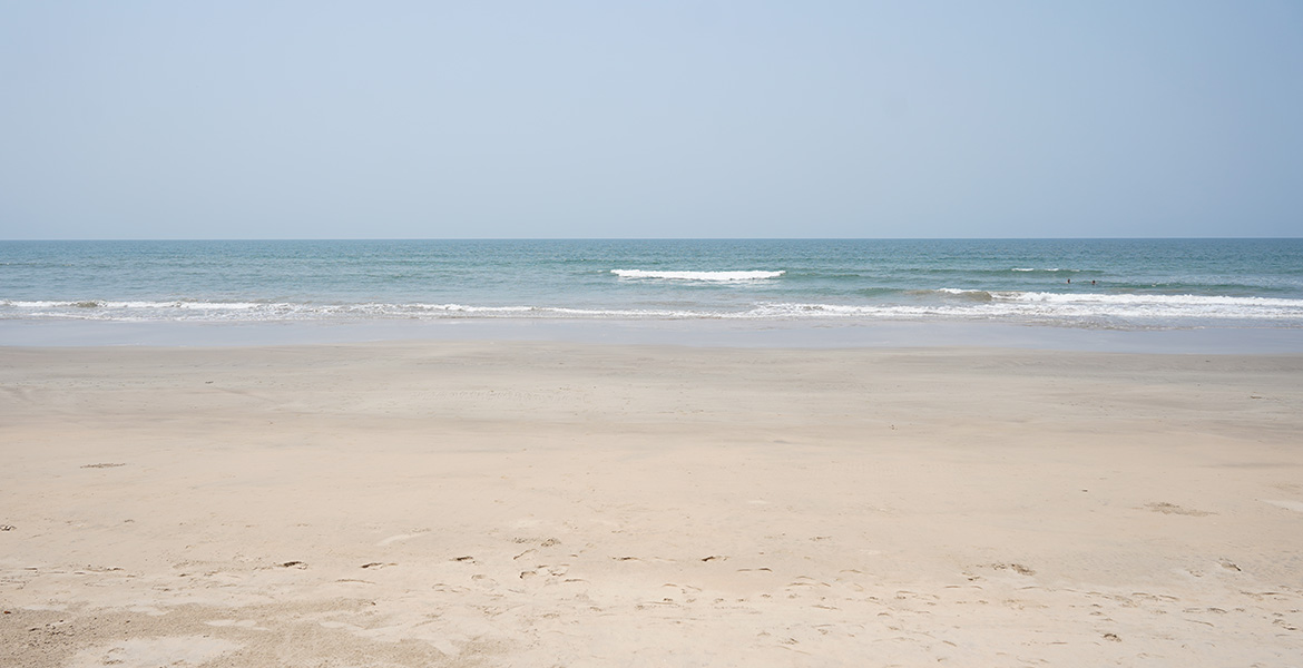 Open sea view with sandy beach at Galgibaga Beach, Goa