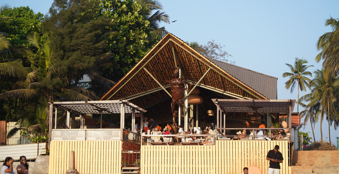 Goa beach club with tropical outdoor seating and wooden architecture