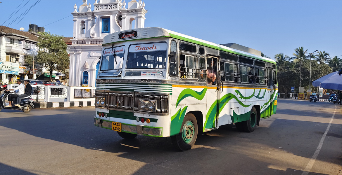Goa local bus passing through a city road