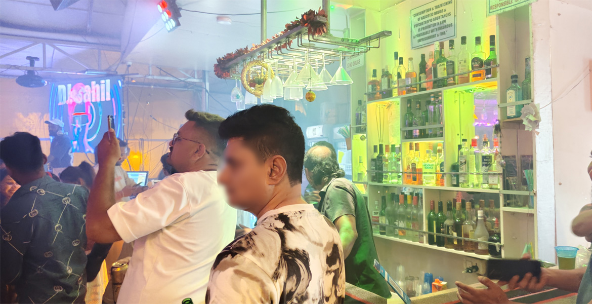 Goa nightlife bar interior with colorful lighting and a busy crowd