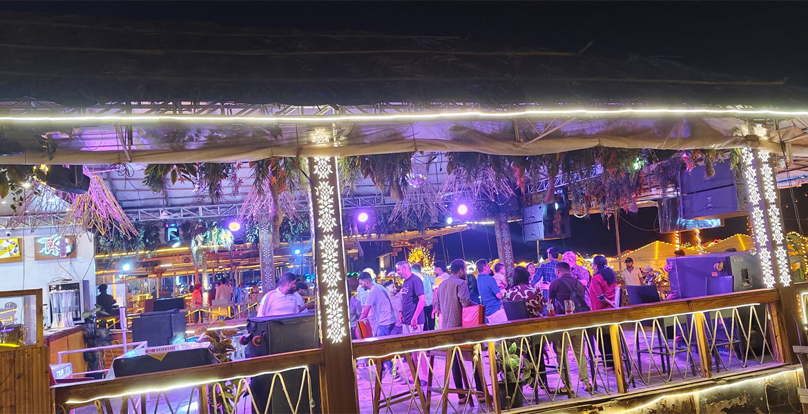Crowd enjoying a lively nightlife party at a Goa beach bar