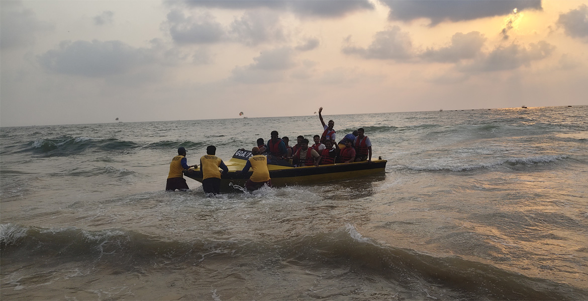 Group boarding a speed boat in Goa