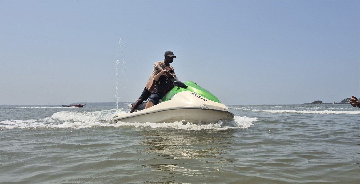 Tourist riding a jet ski in Goa
