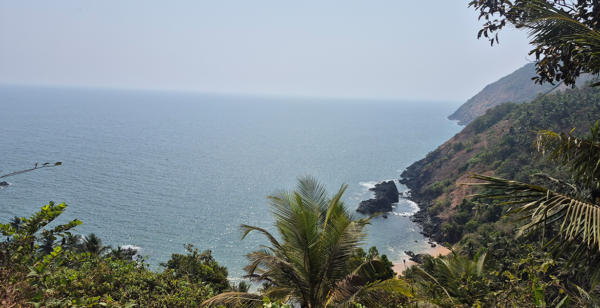 Cliff and sea view at Kakolem Beach, Goa