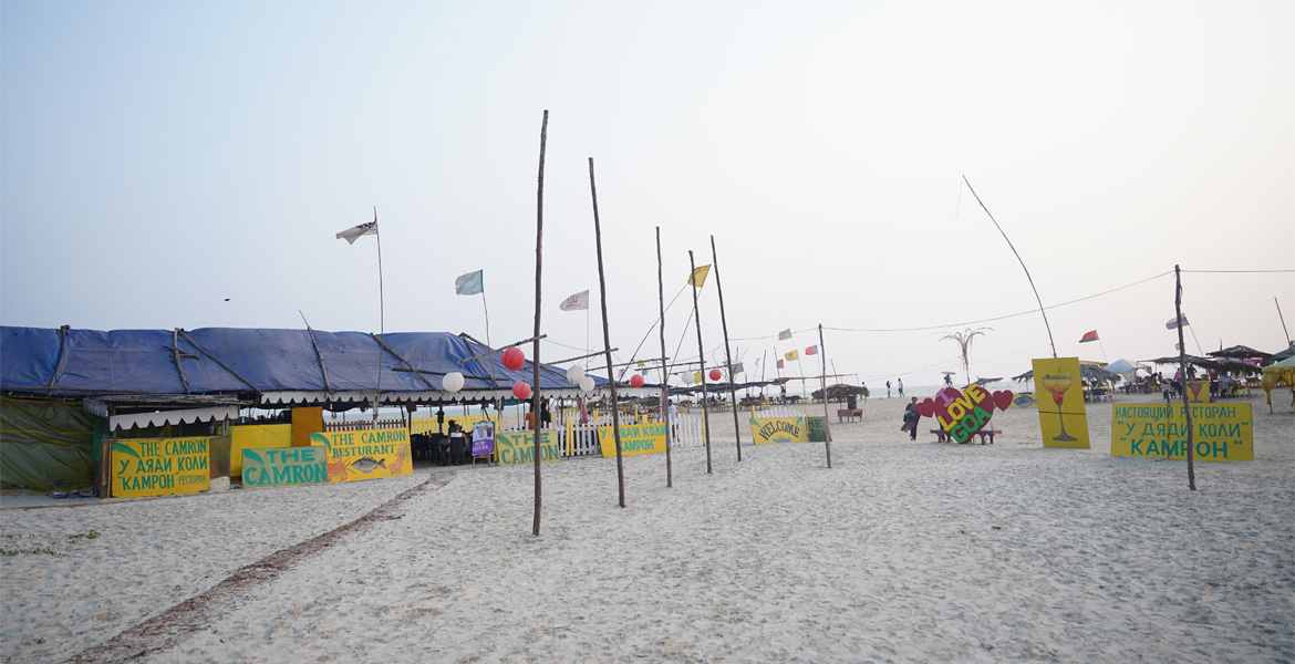 Beach shacks and seaside restaurants on the sandy shores of Majorda Beach Goa with a lively coastal atmosphere