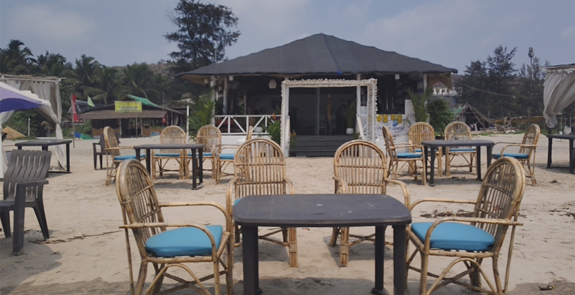 Beachfront restaurant seating at Mandrem Beach, Goa